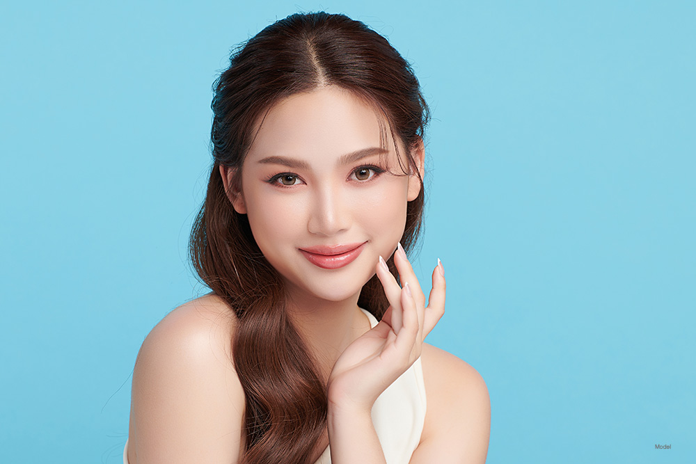 Woman with pink lipstick smiling