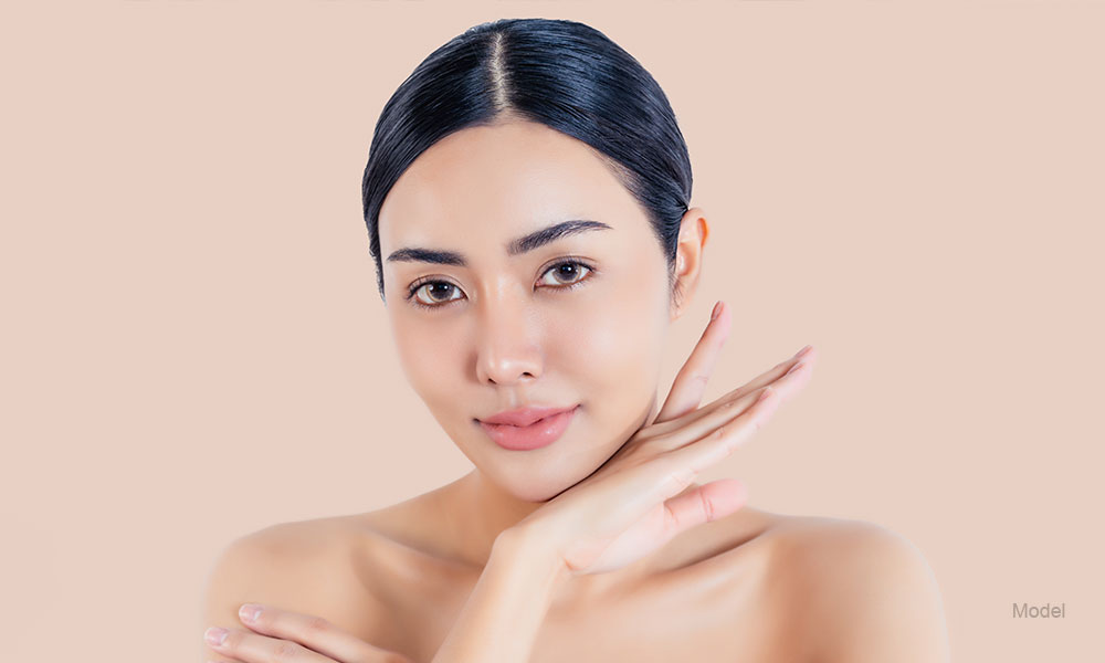 Women touching under soft chin skin close up face