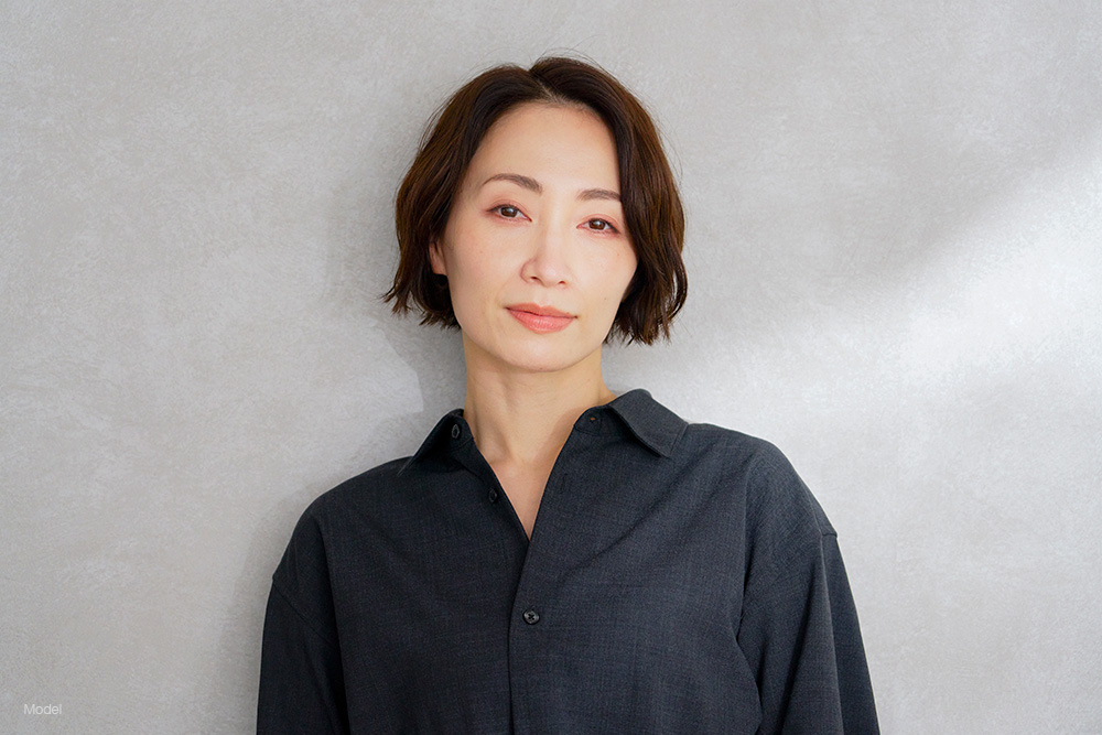 Mature asian woman in a black shirt