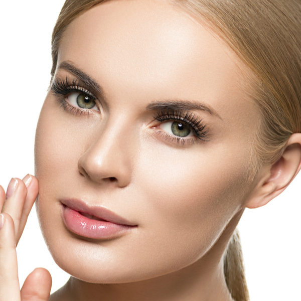 shutterstock_1495073156 blond girl touching her face