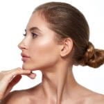 shutterstock_557939821 woman touching her chin